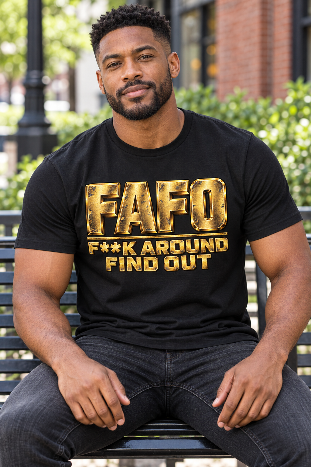 Distressed gold FAFO bold graphic on a black T-shirt worn by a male model