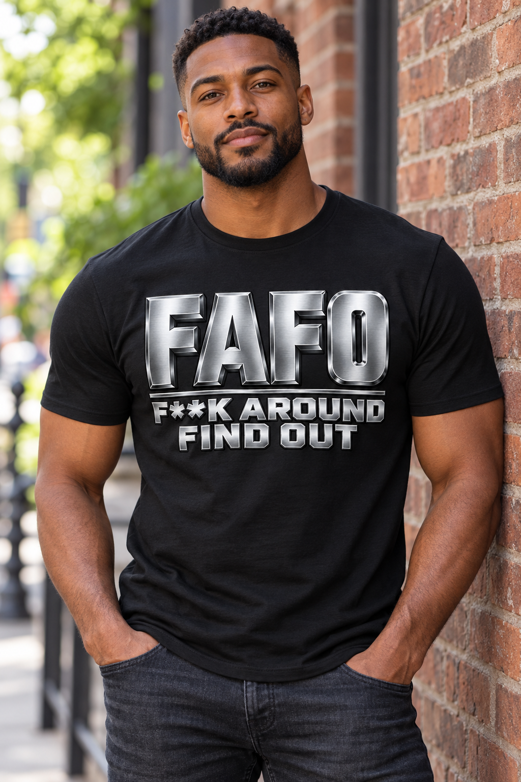 Silver FAFO bold graphic on a black T-shirt worn by a male model